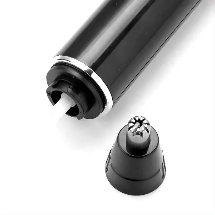Black and silver electric shaver with attachments on a white background