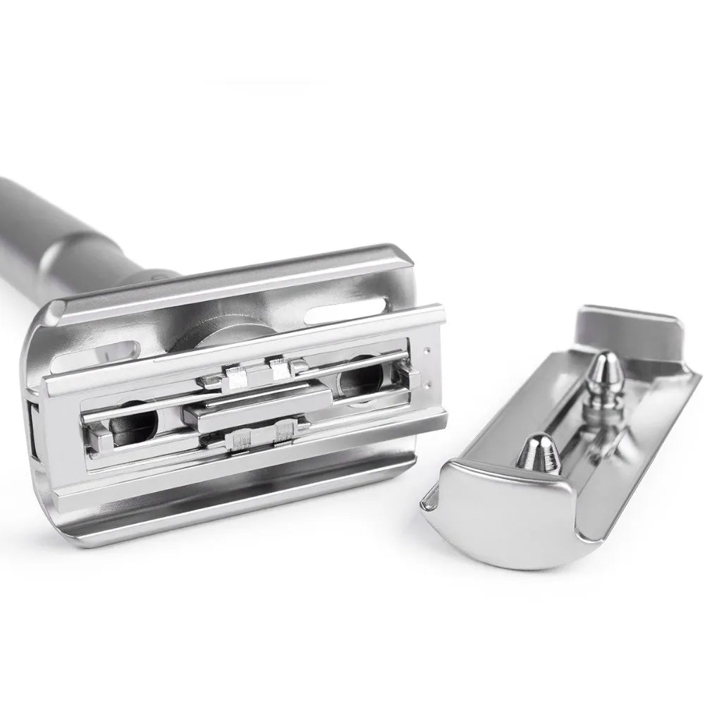 Silver safety razor on a white background
