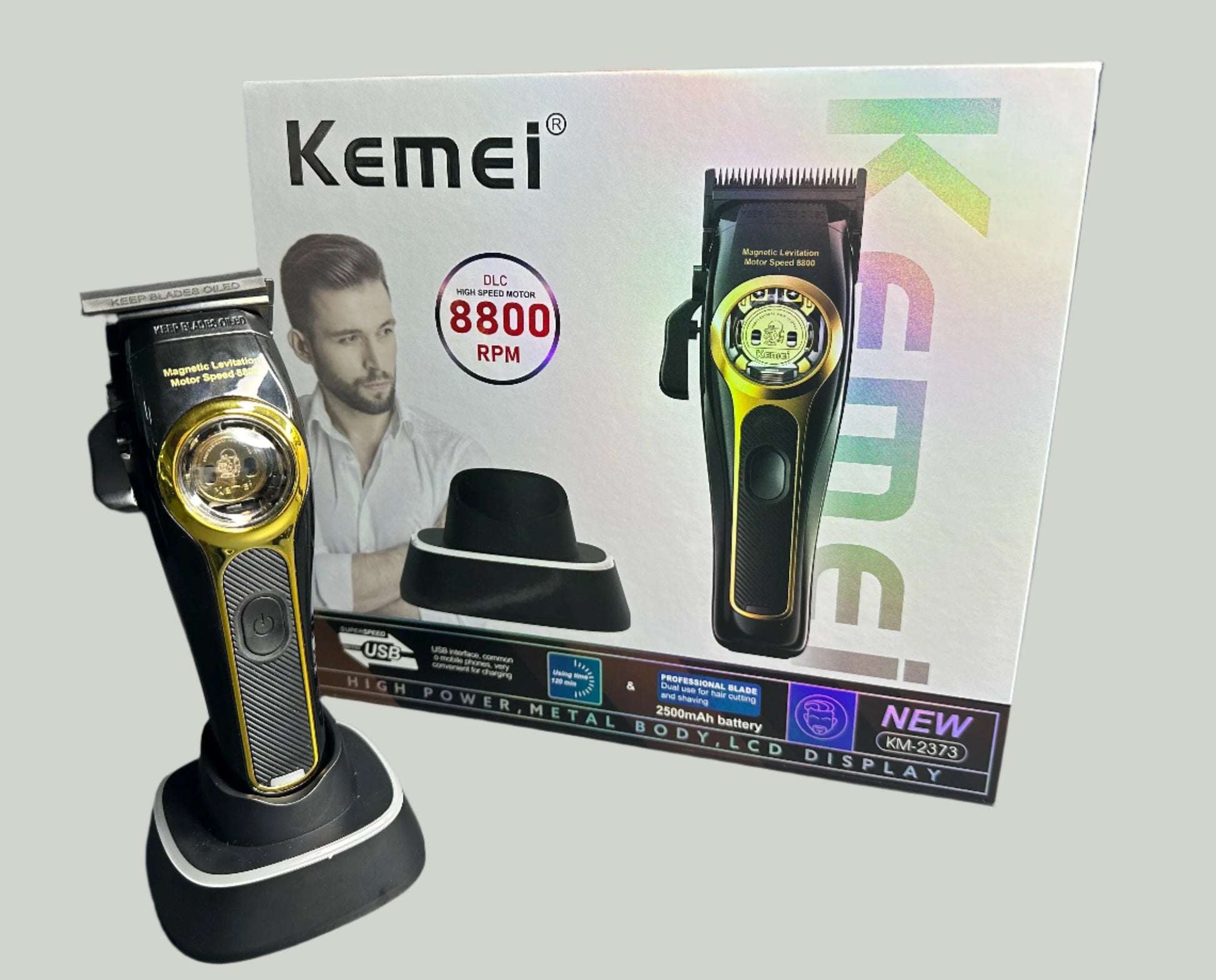 Kemei hair trimmer with packaging on a gray surface