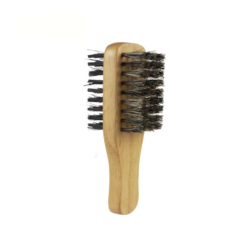 Small wooden brush with bristles on a white background
