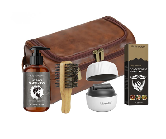 Beard grooming kit with brown leather case, beard wash bottle, brush, and oil packaging on a white background.
