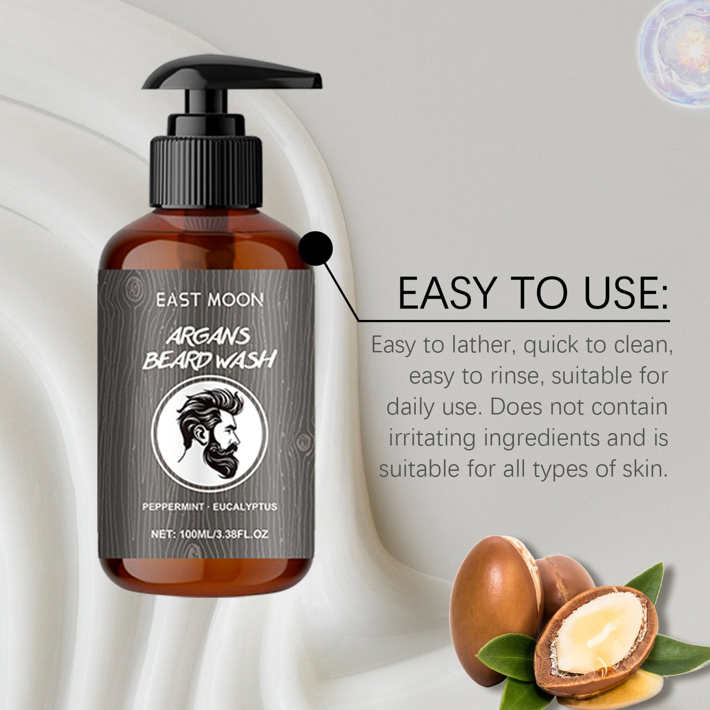 Brown bottle of East Moon Argan Beard Wash with pump on a light background