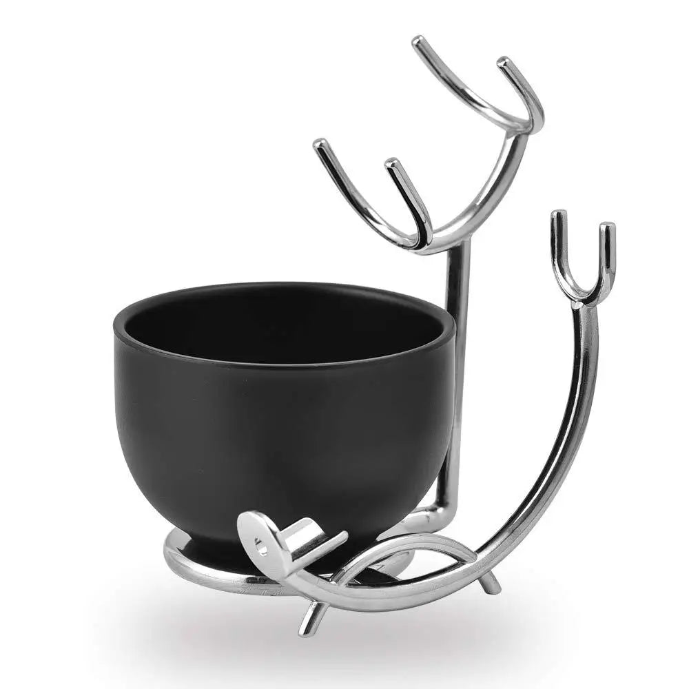 Black bowl with a decorative metal stand on a white background