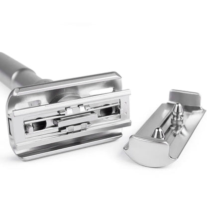 Silver safety razor on a white background