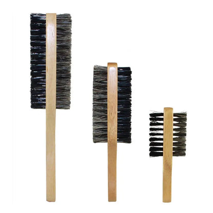 Three wooden brushes with bristle heads on a white background