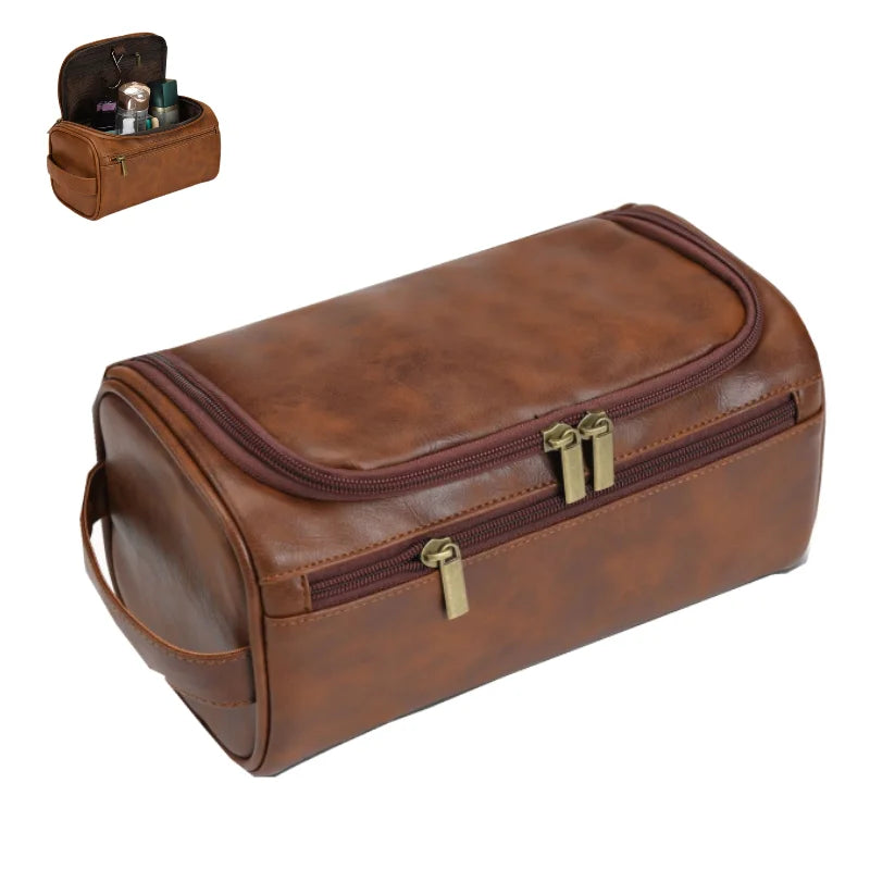 Brown leather toiletry bag with gold zippers on a white background