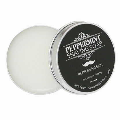 Peppermint shaving soap in a tin with a black label on a white background