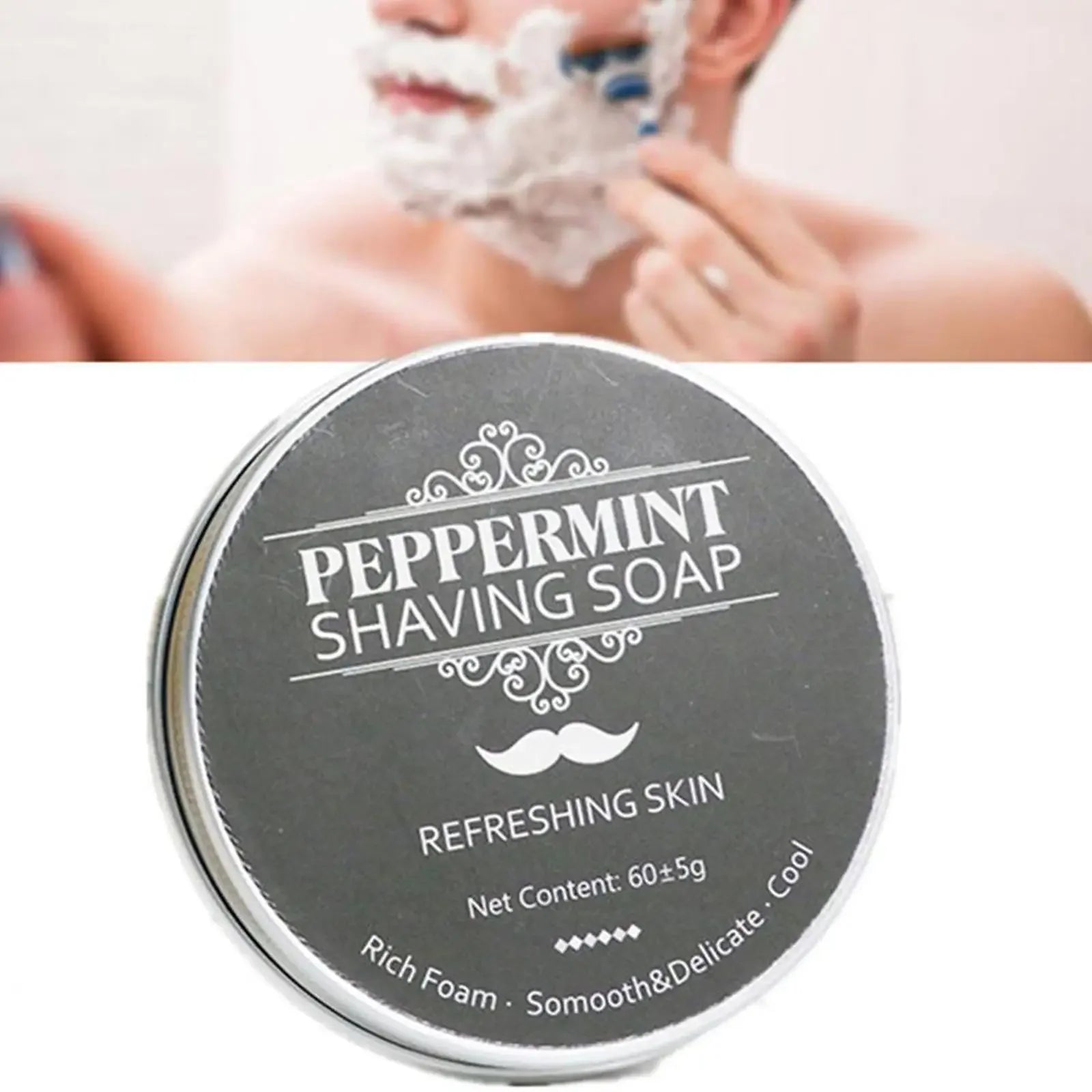 Peppermint shaving soap container with a blurred background of a person shaving.