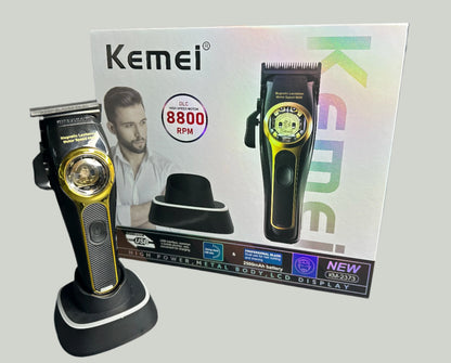 Kemei hair trimmer with packaging on a gray surface